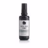 Harmonizing roomspray van Rock Your World, in een glazen flesje met een wit jade groen label.