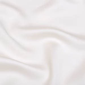 Close-up van de luxe TENCEL™ Lyocell stof van Coco & Cici Luxe Beddengoed in crème, die de zachte textuur en fijne afwerking benadrukt.